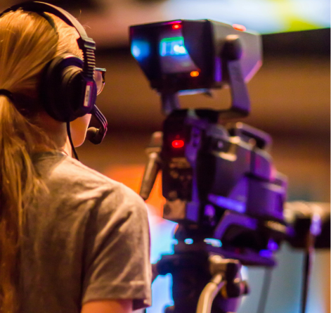 Media professional recording video with camera