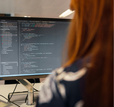 Person reviewing code on a computer screen
